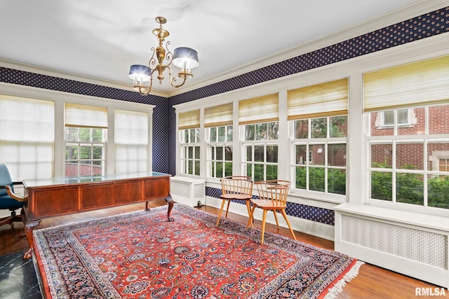 1044 Williams Blvd, Springfield, IL 62704 - sunroom / solarium featuring radiator heating unit, crown molding, a chandelier, wallpapered walls, and wood finished floors