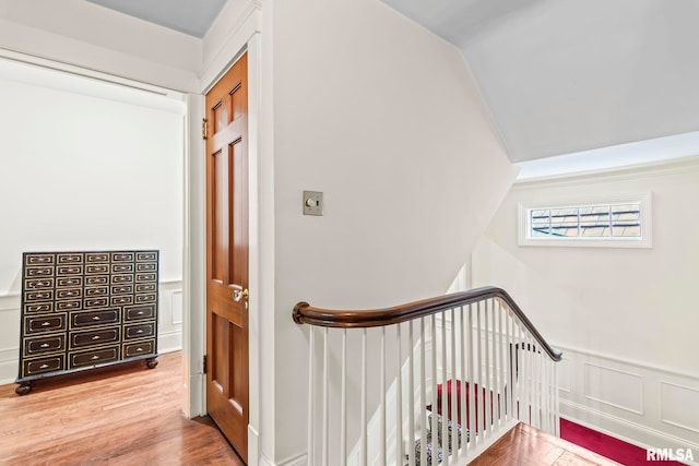 1044 Williams Blvd, Springfield, IL 62704 - stairway with wood finished floors, wainscoting, vaulted ceiling, and a decorative wall