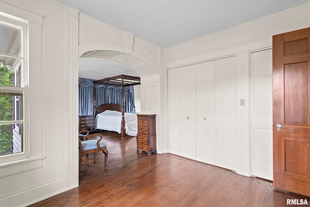 1044 Williams Blvd, Springfield, IL 62704 - unfurnished bedroom featuring wood finished floors, a closet, and arched walkways