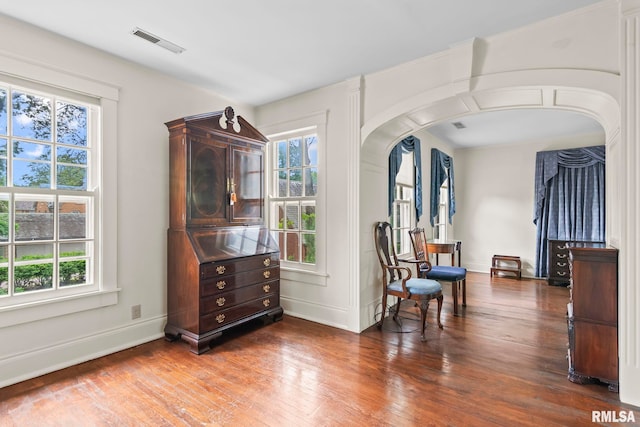 1044 Williams Blvd, Springfield, IL 62704 - living area with arched walkways, baseboards, and wood finished floors