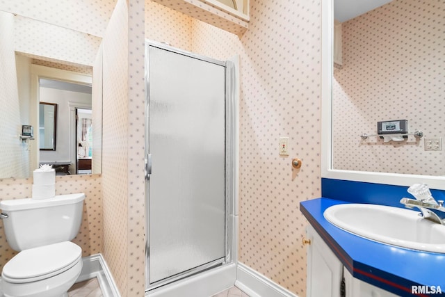 1044 Williams Blvd, Springfield, IL 62704 - full bath with wallpapered walls, a shower stall, toilet, vanity, and baseboards