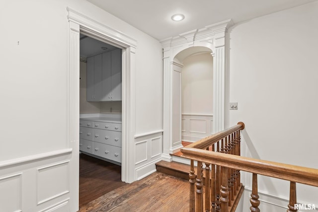 1044 Williams Blvd, Springfield, IL 62704 - hall featuring wood finished floors, a decorative wall, a wainscoted wall, and arched walkways