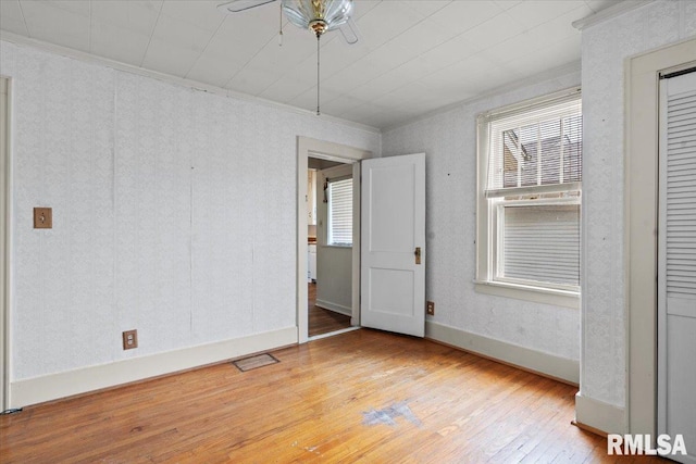 1708 Holmes Ave, Springfield, IL 62704 - spare room featuring ornamental molding, hardwood / wood-style flooring, and ceiling fan