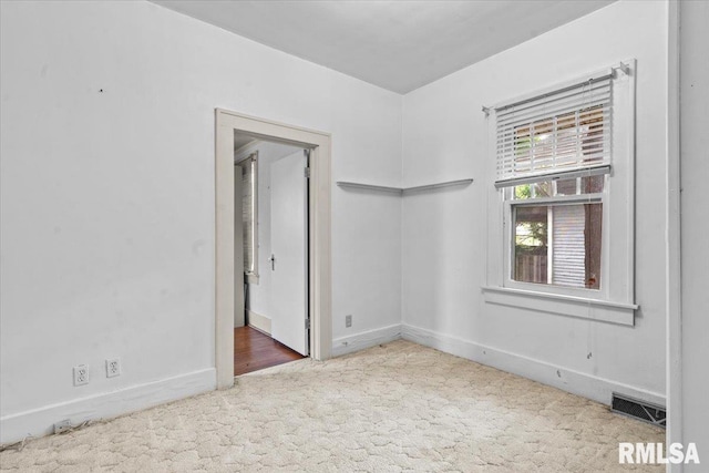 1708 Holmes Ave, Springfield, IL 62704 - spare room featuring carpet flooring and baseboards