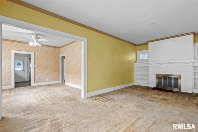 1708 Holmes Ave, Springfield, IL 62704 - unfurnished living room featuring crown molding, carpet floors, baseboards, a fireplace, and ceiling fan