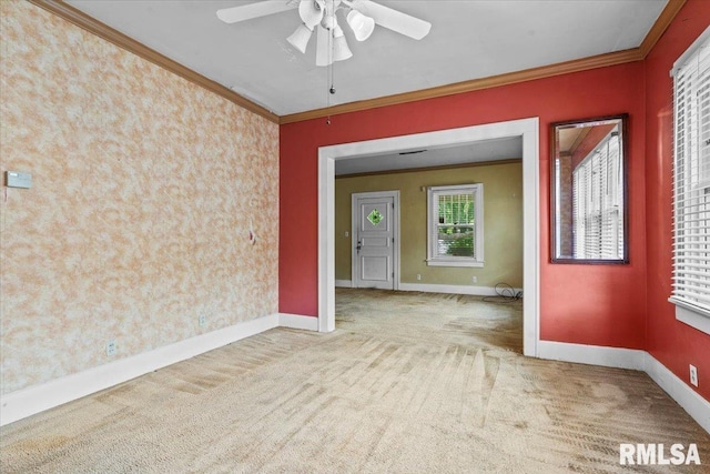 1708 Holmes Ave, Springfield, IL 62704 - unfurnished room featuring carpet floors, crown molding, baseboards, and ceiling fan
