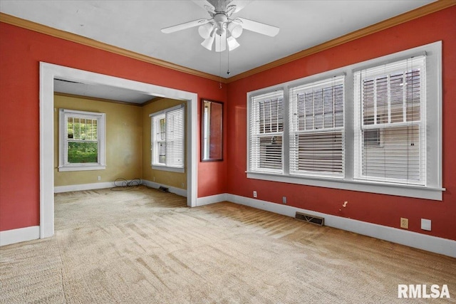 1708 Holmes Ave, Springfield, IL 62704 - carpeted spare room with crown molding, baseboards, and a ceiling fan