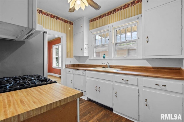 1708 Holmes Ave, Springfield, IL 62704 - kitchen with a sink, white dishwasher, ceiling fan, white cabinets, and dark wood finished floors