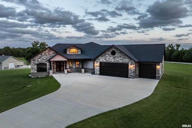 4811 Bitter Ct, Quincy, IL 62305 - view of front of home featuring stone siding, concrete driveway, and an attached garage