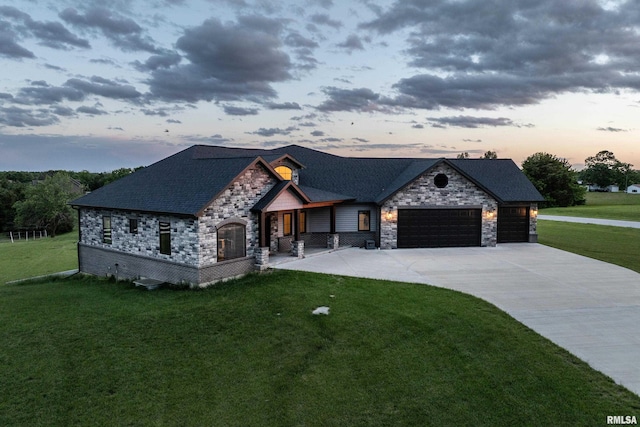 4811 Bitter Ct, Quincy, IL 62305 - view of front of property featuring stone siding, a lawn, and a garage