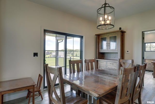 4811 Bitter Ct, Quincy, IL 62305 - dining room with light wood finished floors and a chandelier