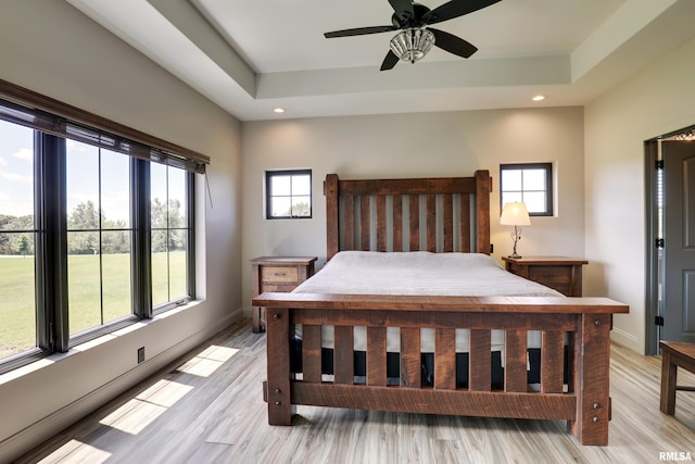 4811 Bitter Ct, Quincy, IL 62305 - bedroom featuring recessed lighting, a raised ceiling, baseboards, light wood finished floors, and a ceiling fan
