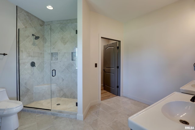 4811 Bitter Ct, Quincy, IL 62305 - bathroom featuring toilet, a shower stall, baseboards, vanity, and tile patterned floors