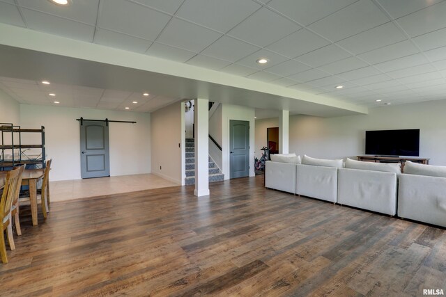 4811 Bitter Ct, Quincy, IL 62305 - living room with a barn door, stairway, wood finished floors, a paneled ceiling, and recessed lighting