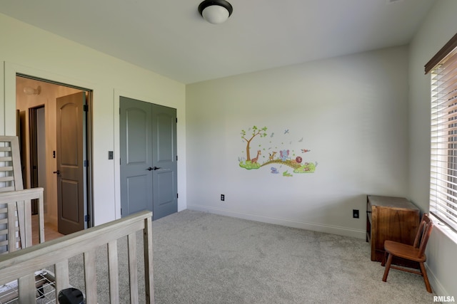 4811 Bitter Ct, Quincy, IL 62305 - unfurnished bedroom with multiple windows, carpet floors, a closet, and baseboards