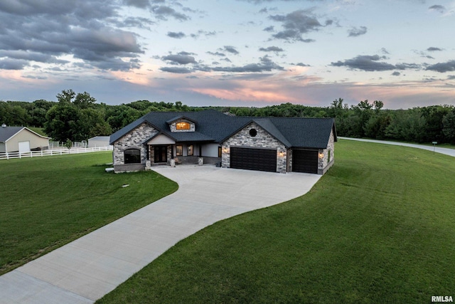 4811 Bitter Ct, Quincy, IL 62305 - french provincial home with stone siding, a garage, and concrete driveway