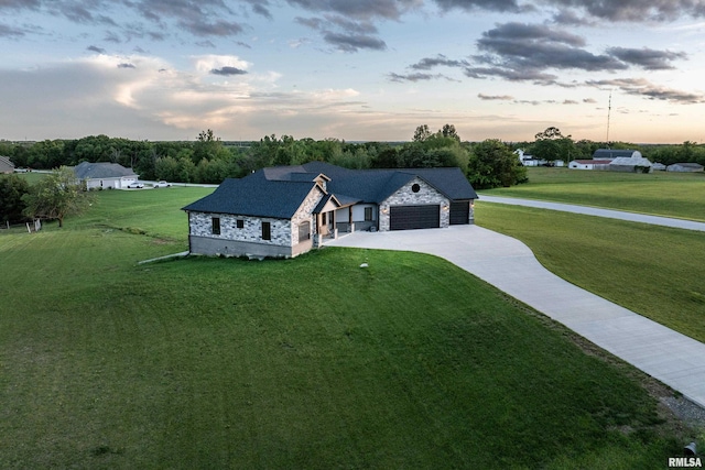 4811 Bitter Ct, Quincy, IL 62305 - view of front of property with stone siding, driveway, a lawn, and a garage