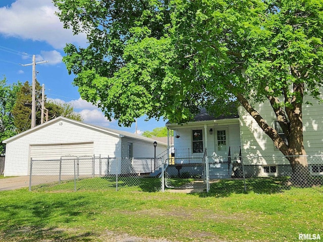 228 4th St, Lincoln, IL 62656 - view of front of home featuring a garage, a porch, and an outdoor structure