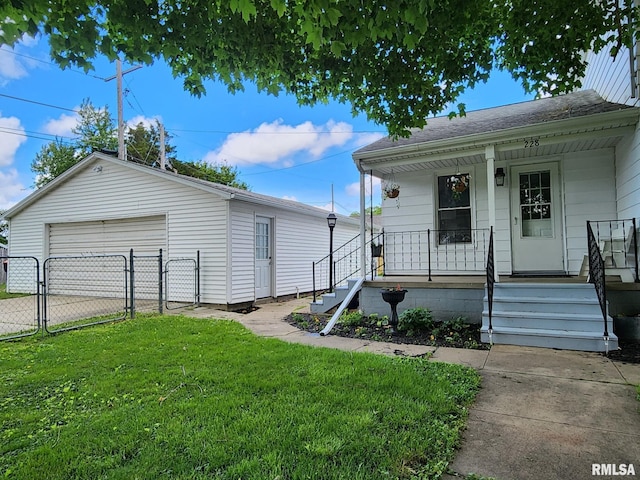 228 4th St, Lincoln, IL 62656 - view of front facade with a garage, covered porch, and a gate