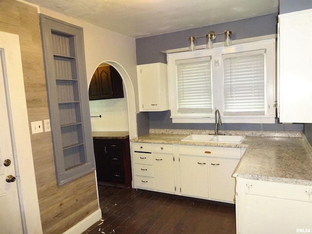 2536 S 10th St, Springfield, IL 62703 - kitchen featuring a sink, light countertops, white cabinetry, and dark wood-type flooring