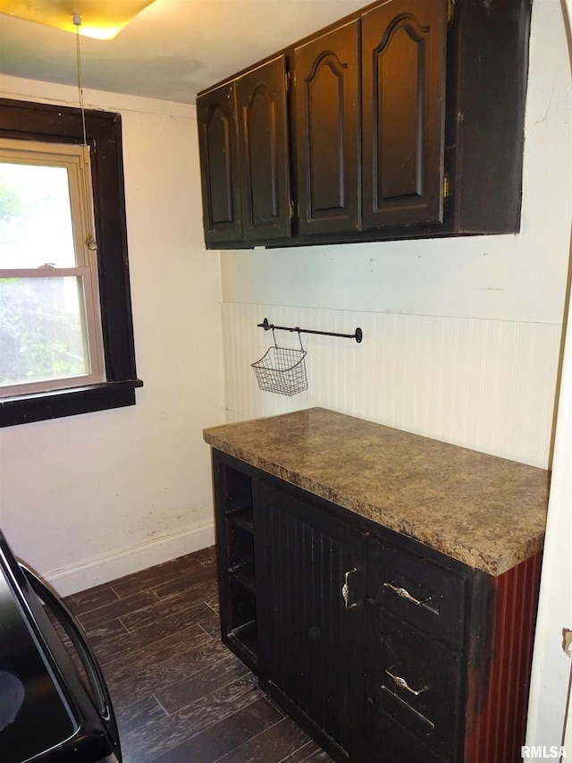 2536 S 10th St, Springfield, IL 62703 - kitchen featuring dark wood-style floors, baseboards, open shelves, and dark countertops
