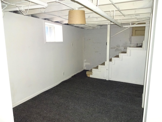 2536 S 10th St, Springfield, IL 62703 - basement with stairs, dark carpet, and baseboards