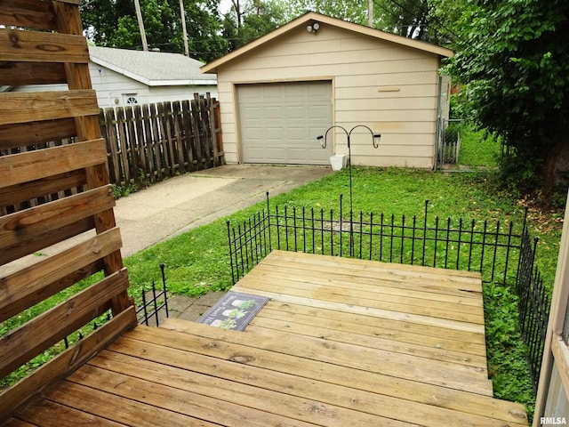 2536 S 10th St, Springfield, IL 62703 - wooden terrace with an outbuilding, concrete driveway, and a garage