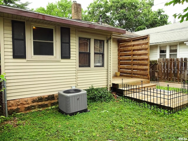 2536 S 10th St, Springfield, IL 62703 - view of home's exterior featuring cooling unit and a chimney