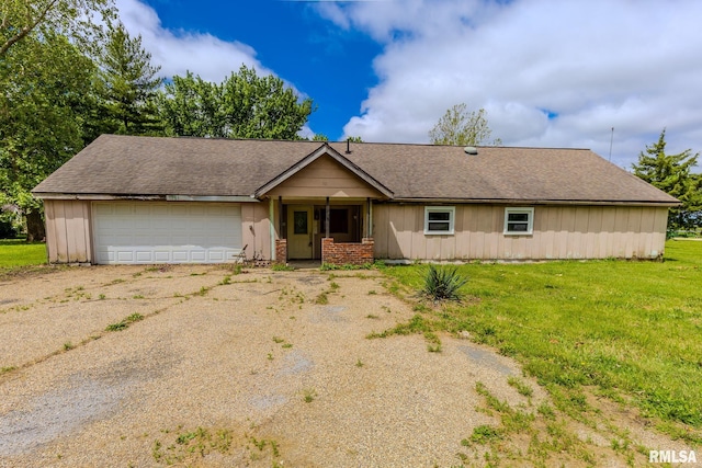 30 Ryder St, Nilwood, IL 62672 - ranch-style house featuring a garage, roof with shingles, driveway, a front lawn, and board and batten siding