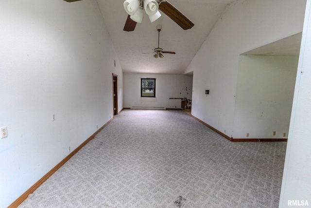 30 Ryder St, Nilwood, IL 62672 - empty room with a ceiling fan, carpet floors, a baseboard radiator, baseboards, and high vaulted ceiling