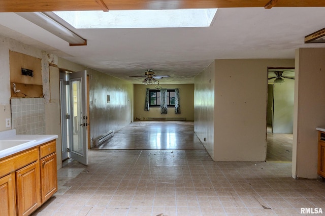 30 Ryder St, Nilwood, IL 62672 - corridor with a baseboard heating unit, a skylight, and a sink