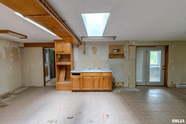 30 Ryder St, Nilwood, IL 62672 - kitchen featuring a sink, light countertops, and a baseboard radiator