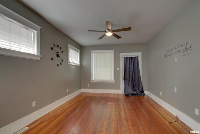 1321 Locust St, Quincy, IL 62301 - empty room with ceiling fan, hardwood / wood-style flooring, and baseboards