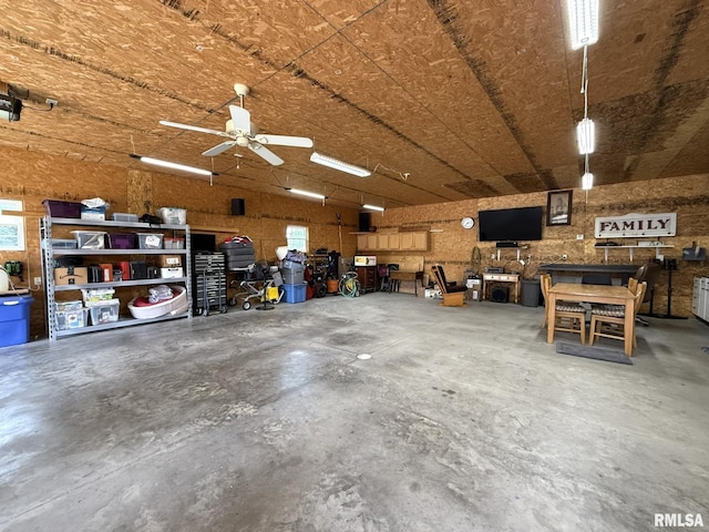 709 W Monmouth St, Abingdon, IL 61410 - garage with a workshop area and a ceiling fan