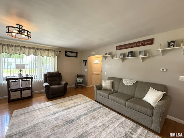 709 W Monmouth St, Abingdon, IL 61410 - living room featuring wood finished floors and baseboards