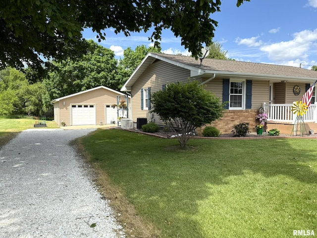 709 W Monmouth St, Abingdon, IL 61410 - ranch-style home featuring an outbuilding, a detached garage, a front lawn, and central AC unit