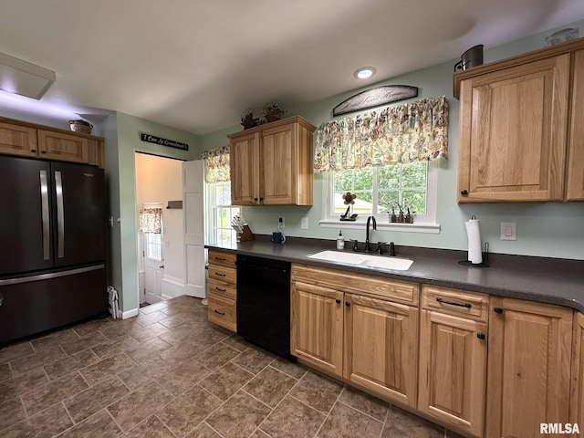 709 W Monmouth St, Abingdon, IL 61410 - kitchen featuring refrigerator, black dishwasher, a sink, and dark countertops