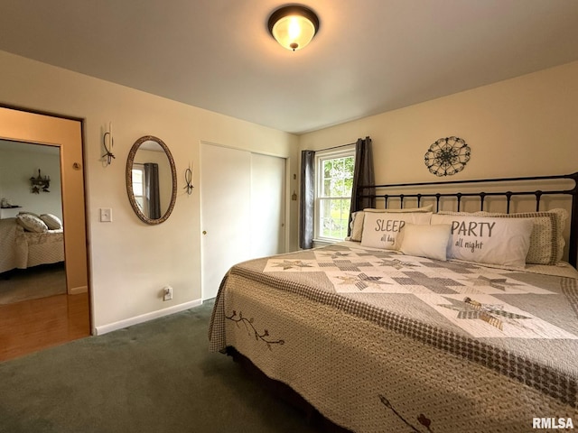 709 W Monmouth St, Abingdon, IL 61410 - bedroom featuring dark colored carpet, a closet, and baseboards