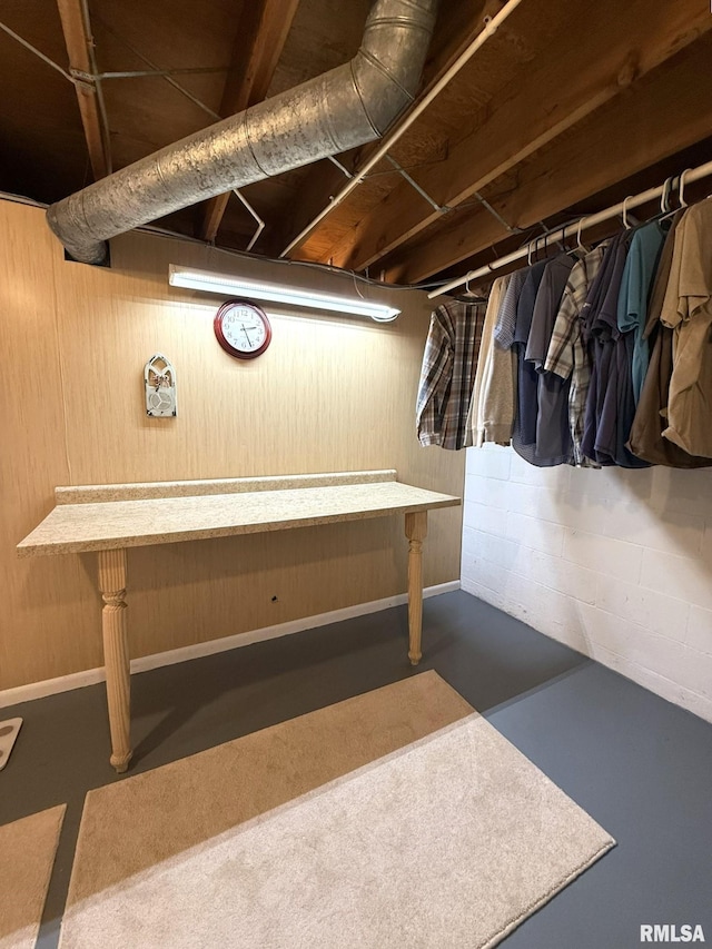 709 W Monmouth St, Abingdon, IL 61410 - misc room with finished concrete floors and wooden walls