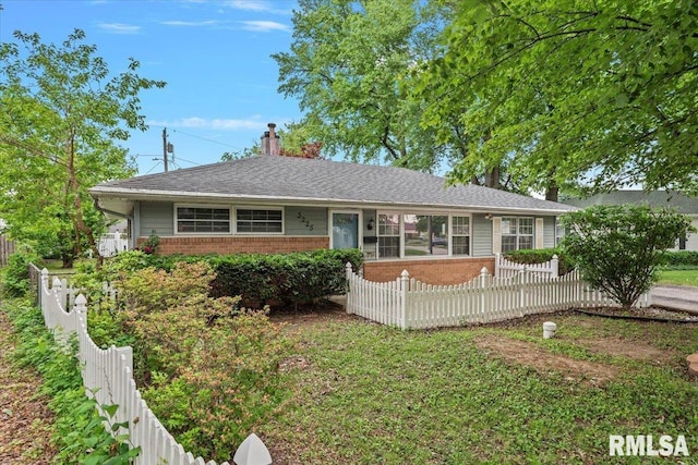 3225 Saxony Rd, Springfield, IL 62703 - ranch-style house featuring brick siding, a fenced backyard, a chimney, and a sunroom