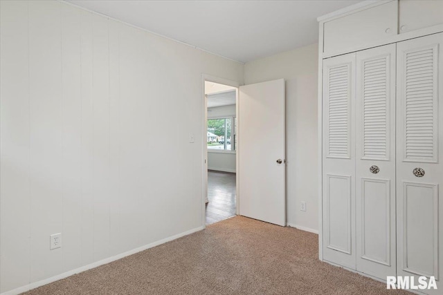 3225 Saxony Rd, Springfield, IL 62703 - unfurnished bedroom featuring carpet, a closet, and baseboards