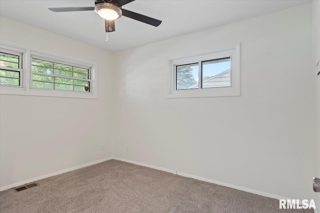 3225 Saxony Rd, Springfield, IL 62703 - carpeted spare room featuring plenty of natural light, baseboards, and ceiling fan