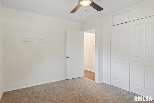 3225 Saxony Rd, Springfield, IL 62703 - unfurnished bedroom featuring carpet, baseboards, a closet, and a ceiling fan