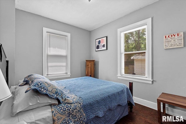 2557 S 6th St, Springfield, IL 62703 - bedroom featuring baseboards and wood finished floors