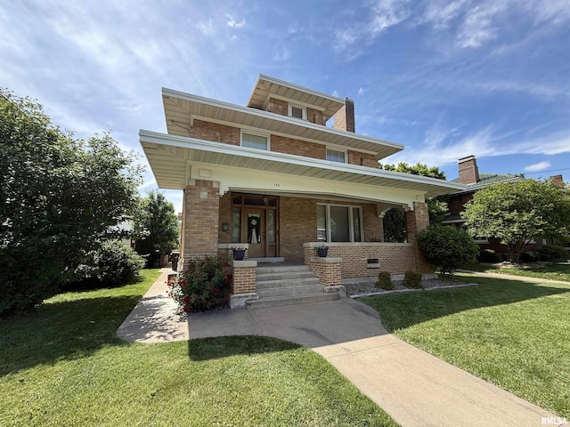 344 S 24th St, Quincy, IL 62301 - traditional style home with covered porch, brick siding, and a front yard