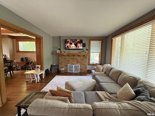 344 S 24th St, Quincy, IL 62301 - living area featuring healthy amount of natural light, dark wood finished floors, and a brick fireplace
