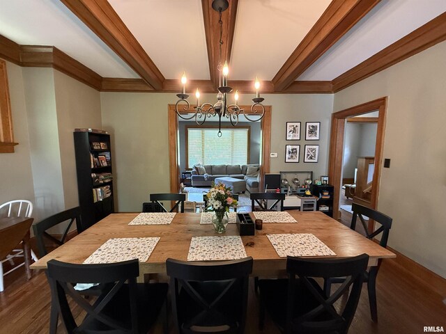 344 S 24th St, Quincy, IL 62301 - dining area with dark wood finished floors, a chandelier, and beamed ceiling