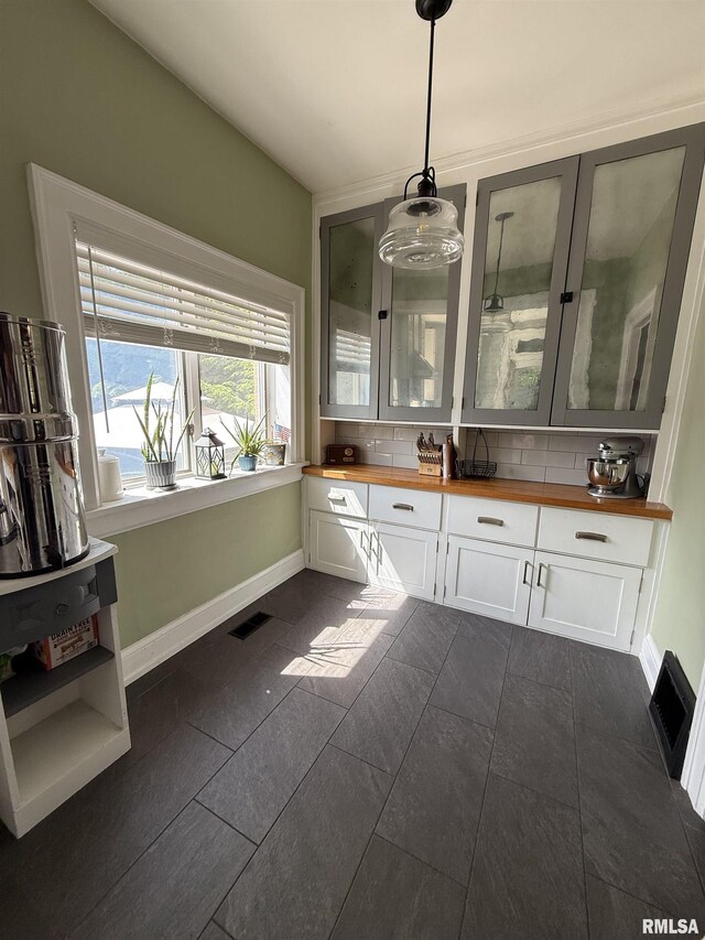 344 S 24th St, Quincy, IL 62301 - bathroom with baseboards, vanity, and tasteful backsplash