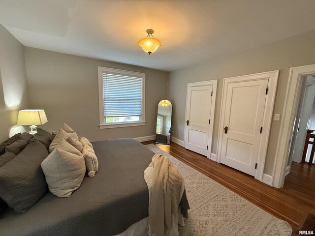 344 S 24th St, Quincy, IL 62301 - bedroom with wood finished floors and baseboards