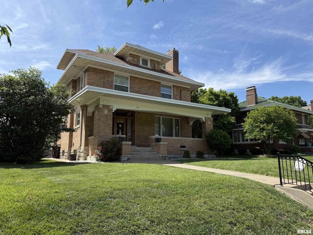 344 S 24th St, Quincy, IL 62301 - american foursquare style home with brick siding, a porch, a front lawn, and a chimney
